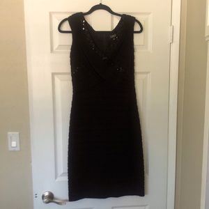 Stunning classic black above the knee dress.